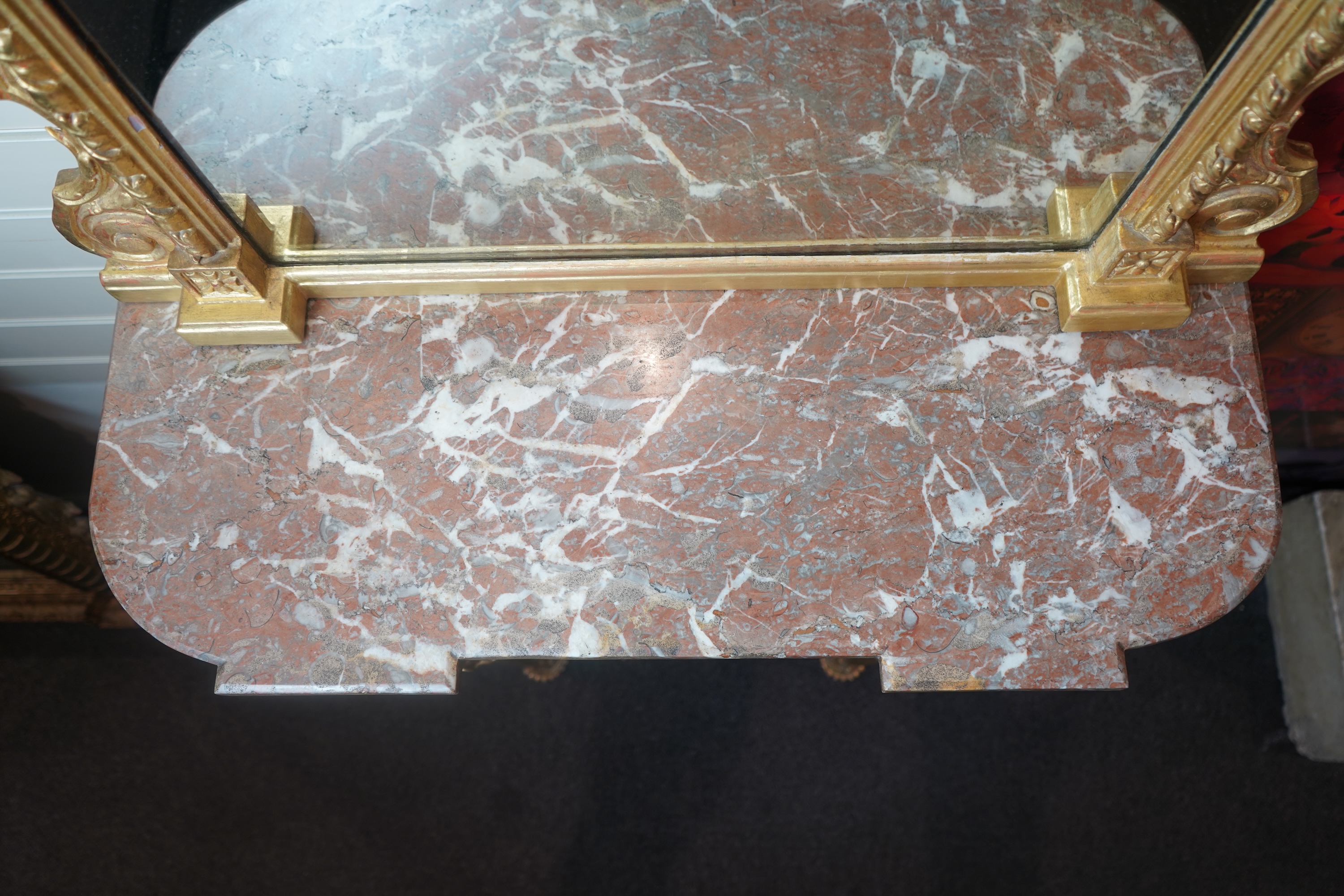 A pair of Louis XVI style giltwood and composition marble topped pier tables and mirrors